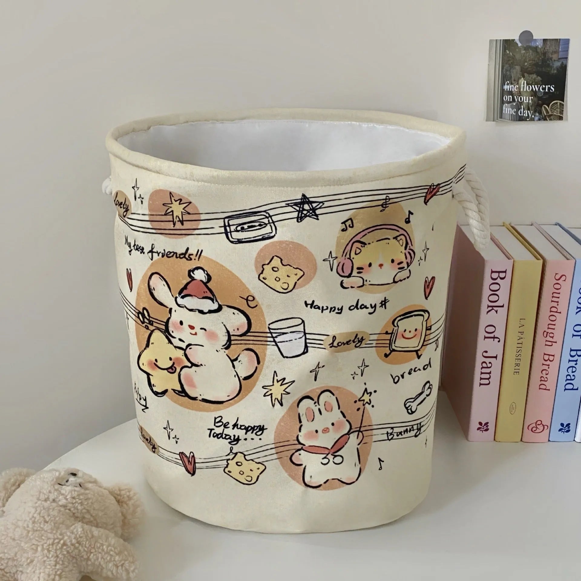 Foldable cotton laundry basket showing one of twelve colour patterns including animal motifs