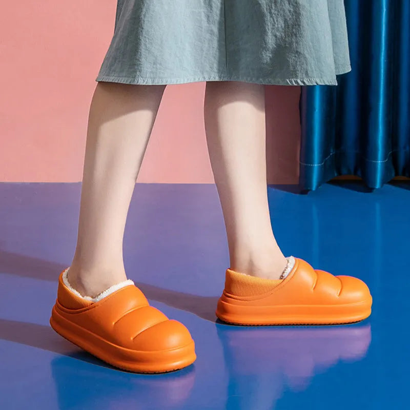 Women's waterproof EVA winter house slippers in multiple colours with plush lining and non-slip sole.