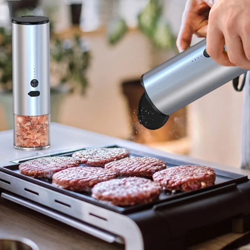 White electric salt and pepper grinder set with LED light and USB charging base