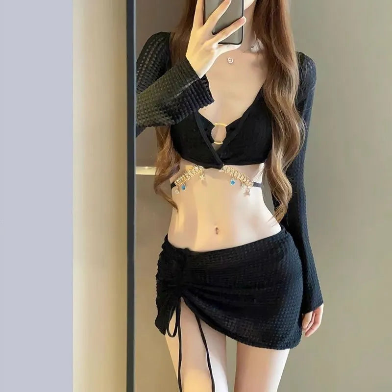 Women's long sleeve split bikini swimsuit in black polyester front view