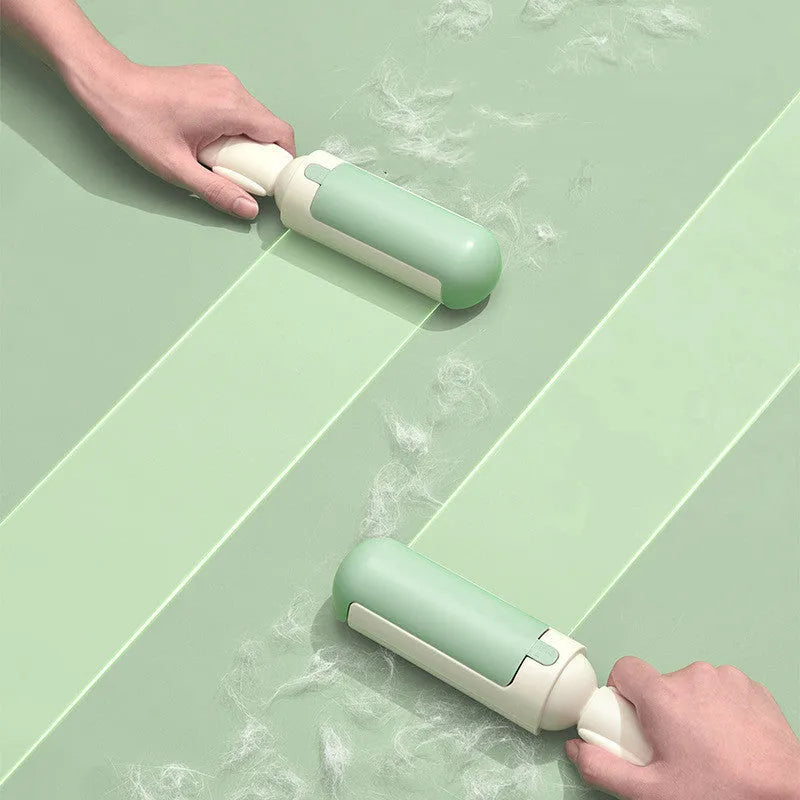 Pet hair remover roller with self-cleaning base, white and green, on a couch