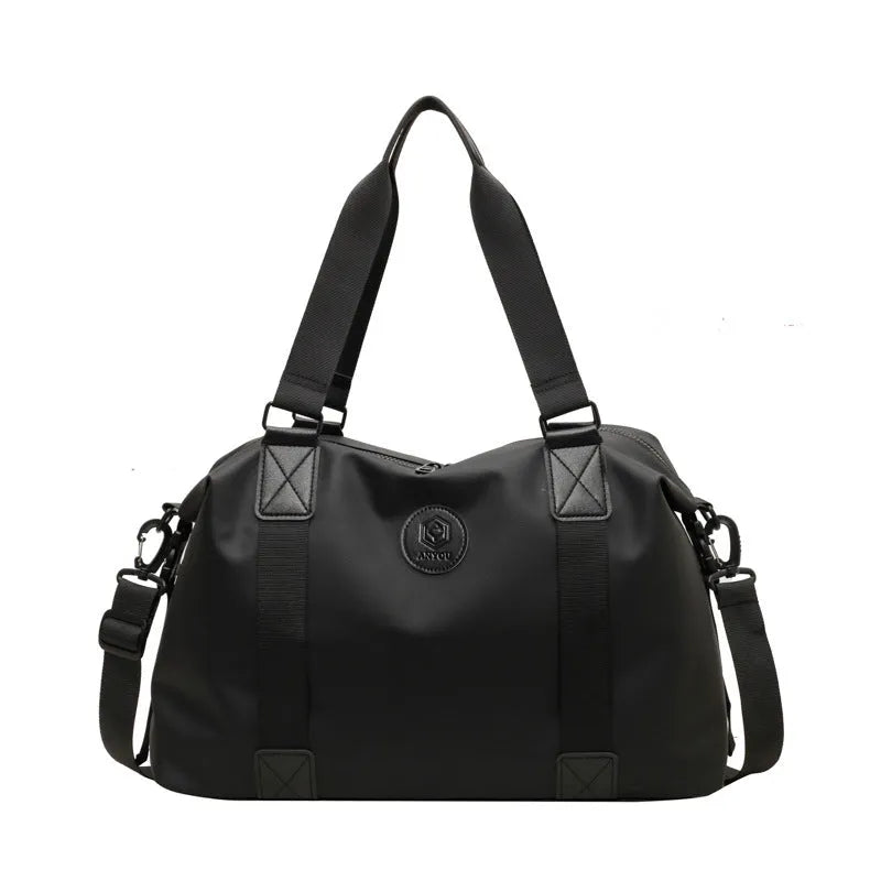 Waterproof Oxford cloth travel bag in black, blue, grey or red with 36-55 litre capacity
