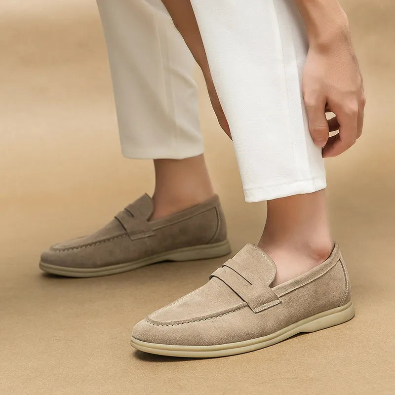 Men's black leather slip-on casual shoes with a round toe and rubber sole.