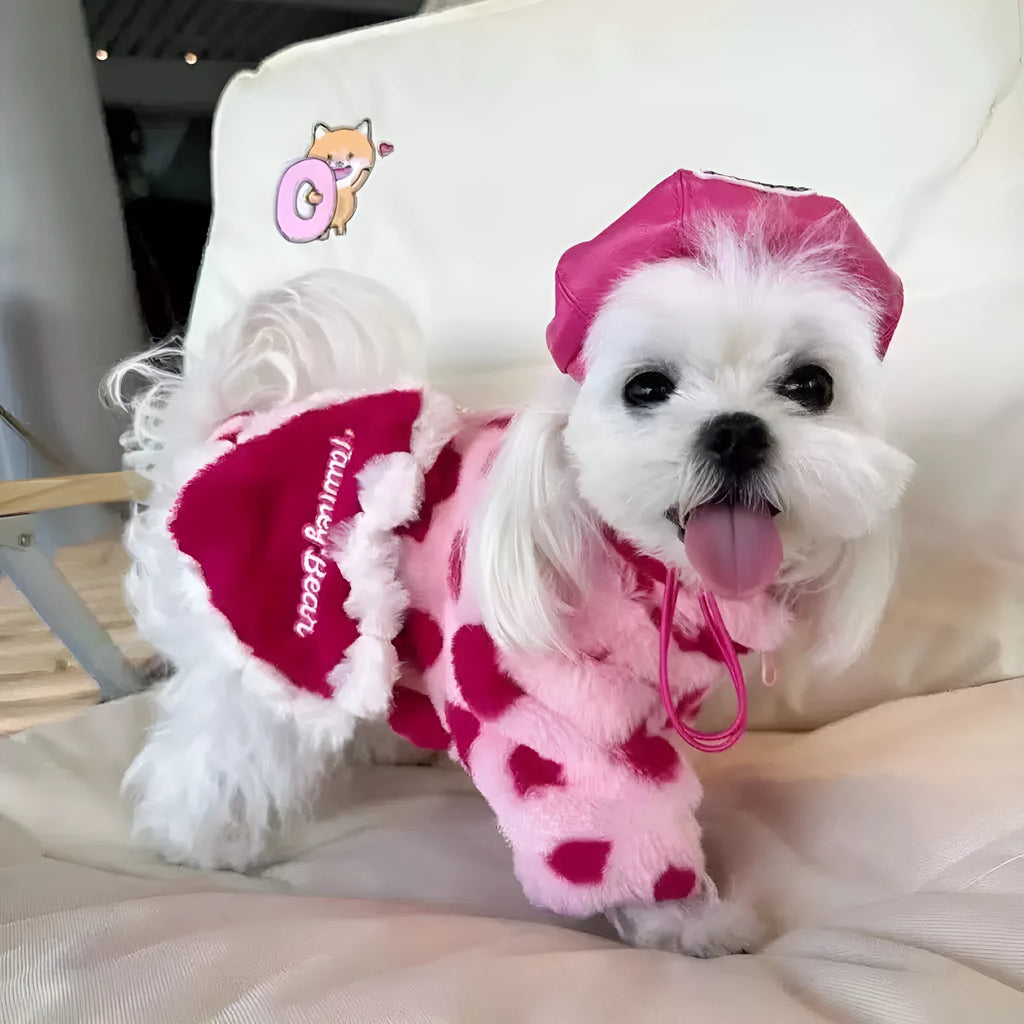 Small dog wearing a plush pink warm coat for cold weather protection