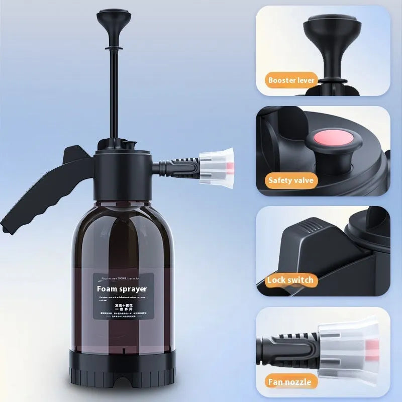 Black 2L foam watering can sprayer with handle and two nozzle attachments on a white background