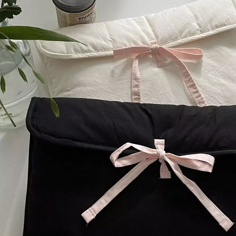 Women's black quilted computer bag with ballet bow and striped pattern