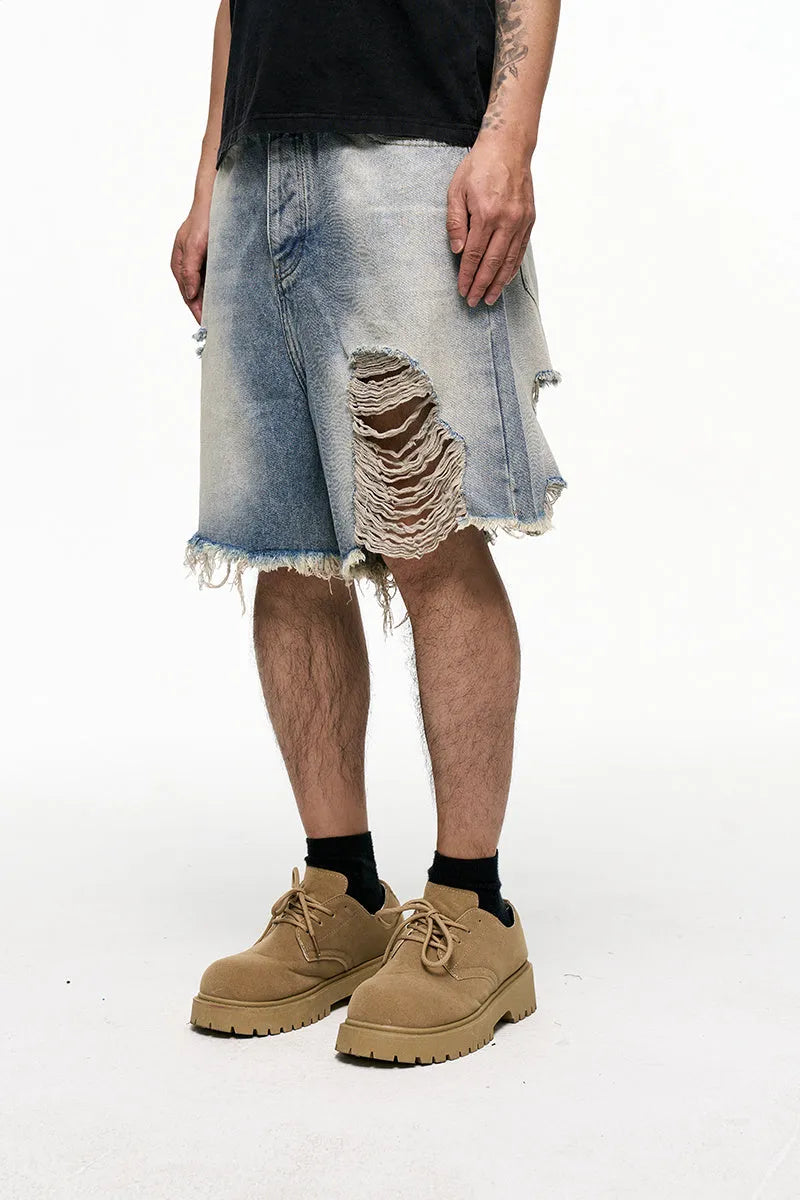 Light blue retro washed men's baggy denim shorts on a hanger showing wide leg fit.