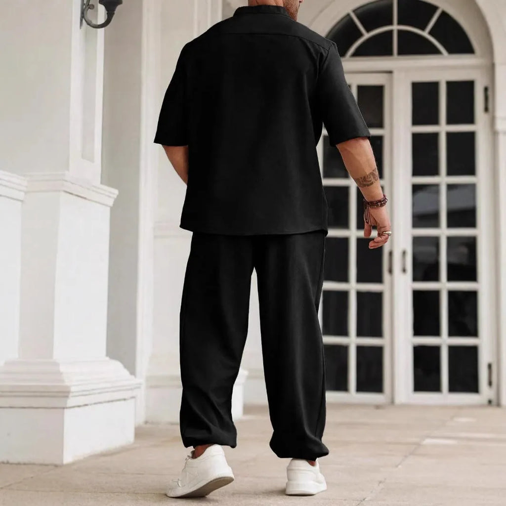 Men's apricot cotton linen casual short sleeve shirt and long trousers set laid flat.