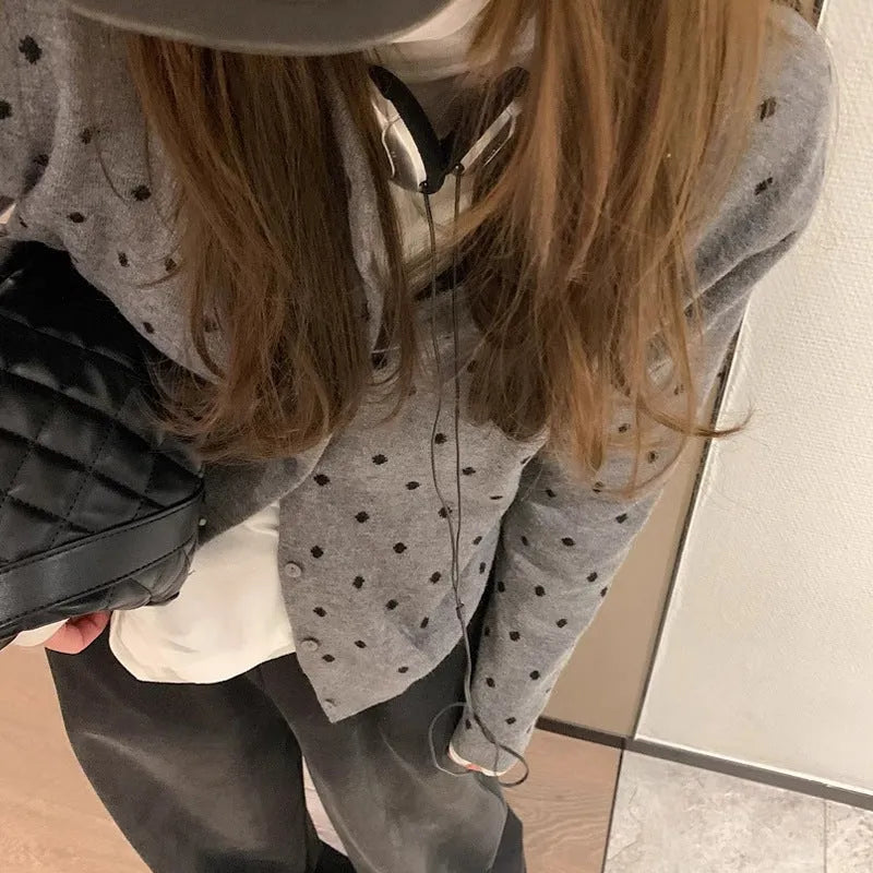 Women's grey knitted cardigan with crochet flower details, loose fit, long sleeves