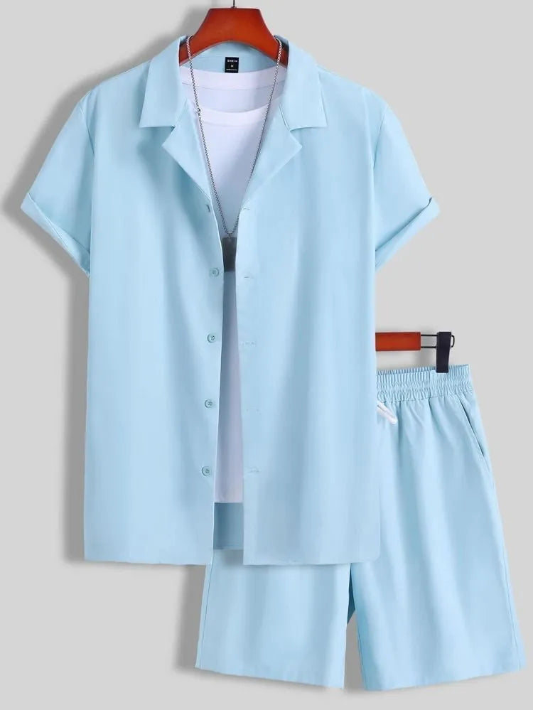 Man wearing a light blue short sleeve Cuban collar shirt and matching sport shorts.