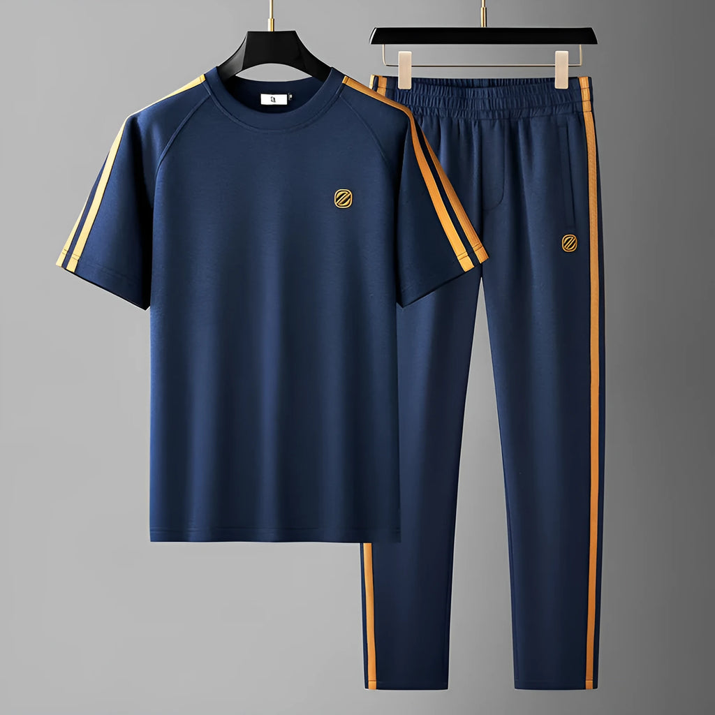 Man wearing a blue short sleeve polyester sports suit, top and trousers, ironing-free and breathable.