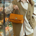Women's retro genuine leather handbag in saddle shape, first layer cowhide, five colours including dark brown and black