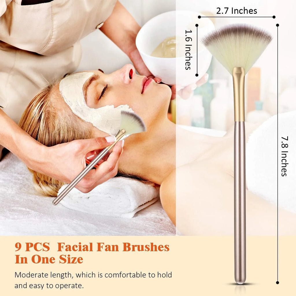 Ten champagne-coloured acrylic handle fan brushes with soft white bristles and clear protective covers.