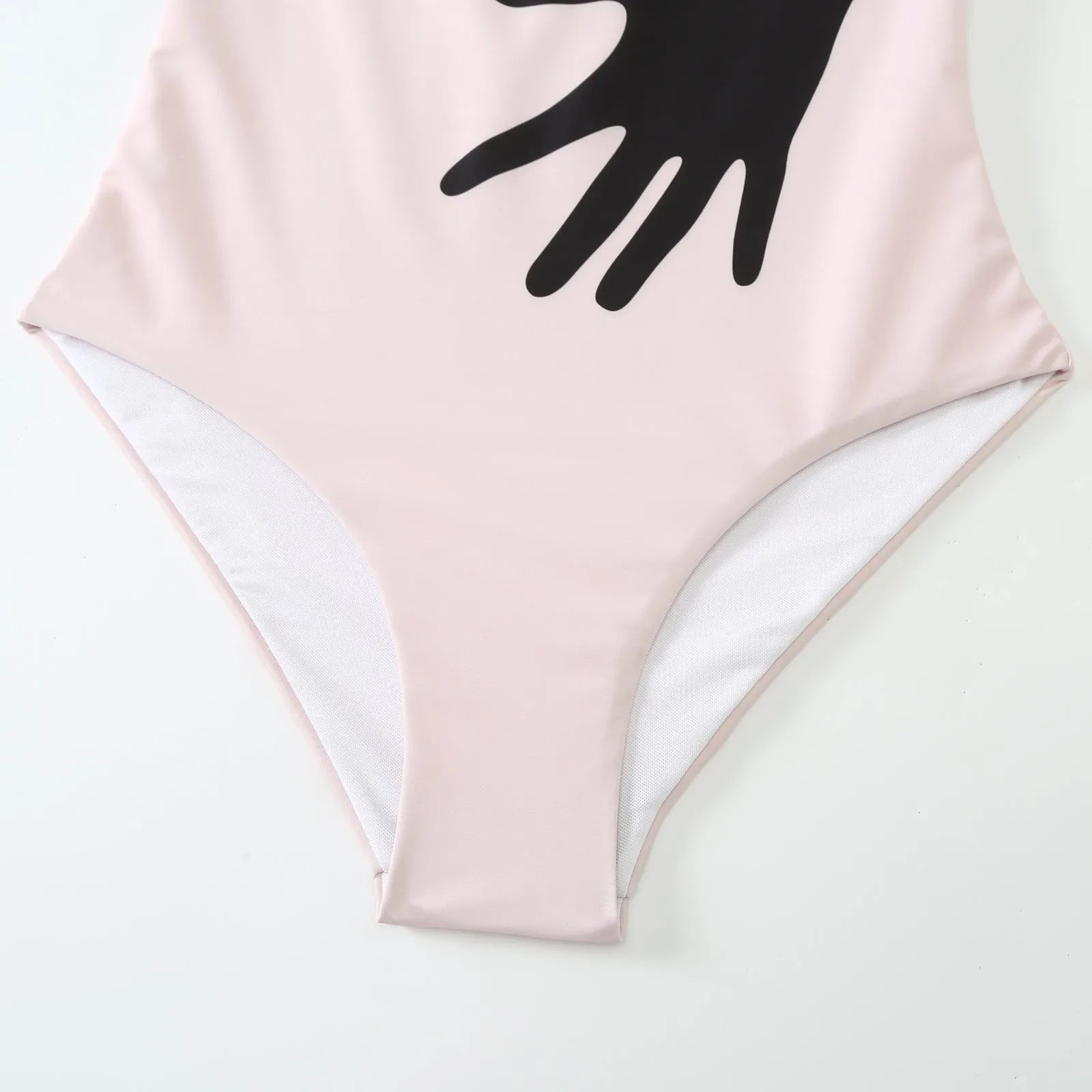 Women's patterned one-piece bikini swimsuit with an attached light tulle skirt.