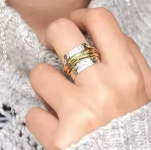 Alloy two-tone ring with hammered metal coil design, electroplated finish, on white background