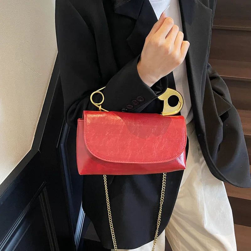 Creative paper clip shoulder handbag in PU leather with sewing thread detail, horizontal square shape
