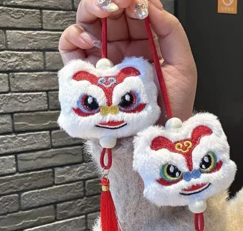 Blue and yellow Chinese lion plush keychain ornament with tassel and star stone details