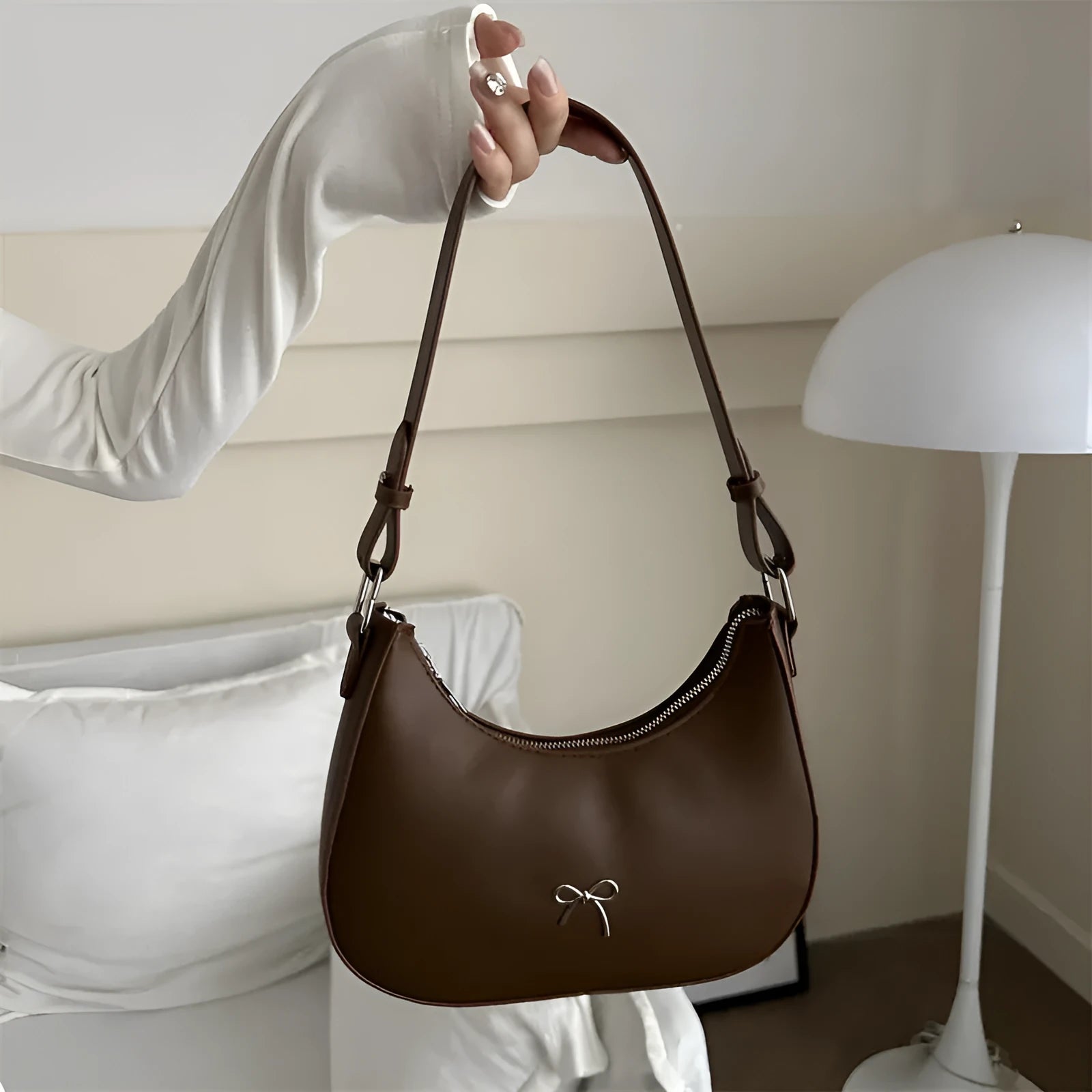 Women's underarm small bag in black PU with single shoulder strap and stitching detail
