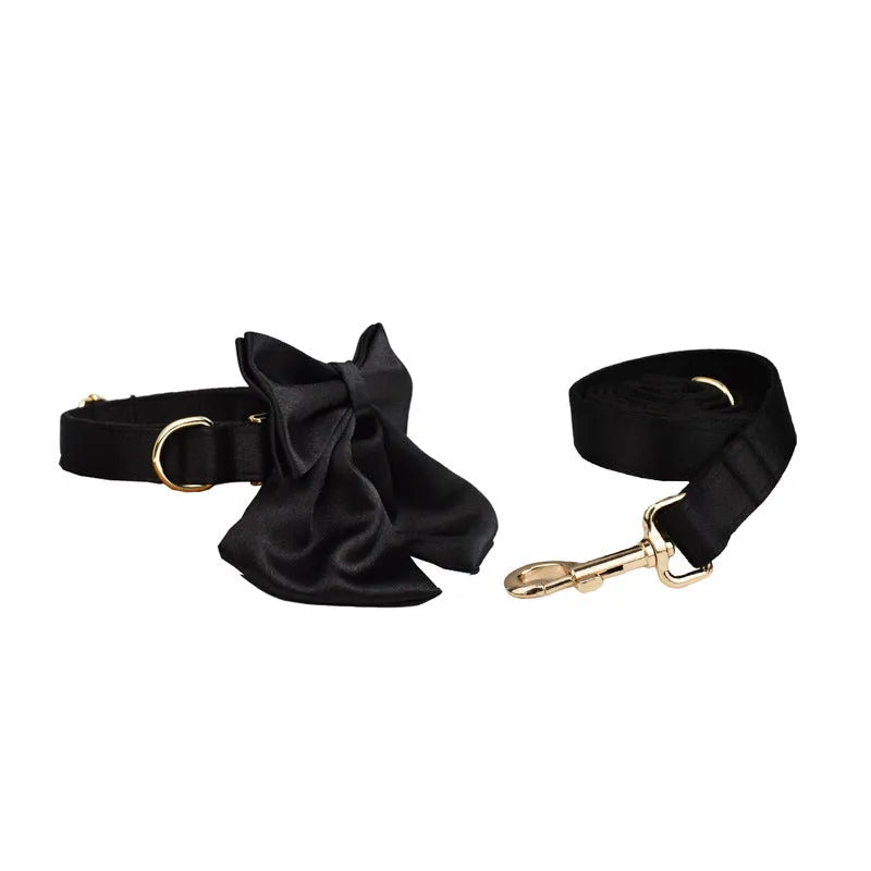 Pet harness set showing cloth collar, leash, decorative bow, and matching vest in four available sizes