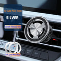Silver magnetic phone holder attached to car air vent with smartphone mounted