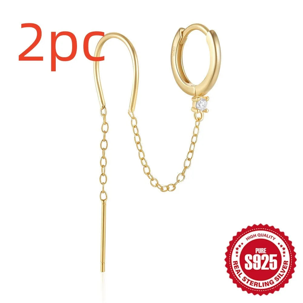 Golden tone sterling silver ear clip studs with a geometric flower, tassel, and chain design.