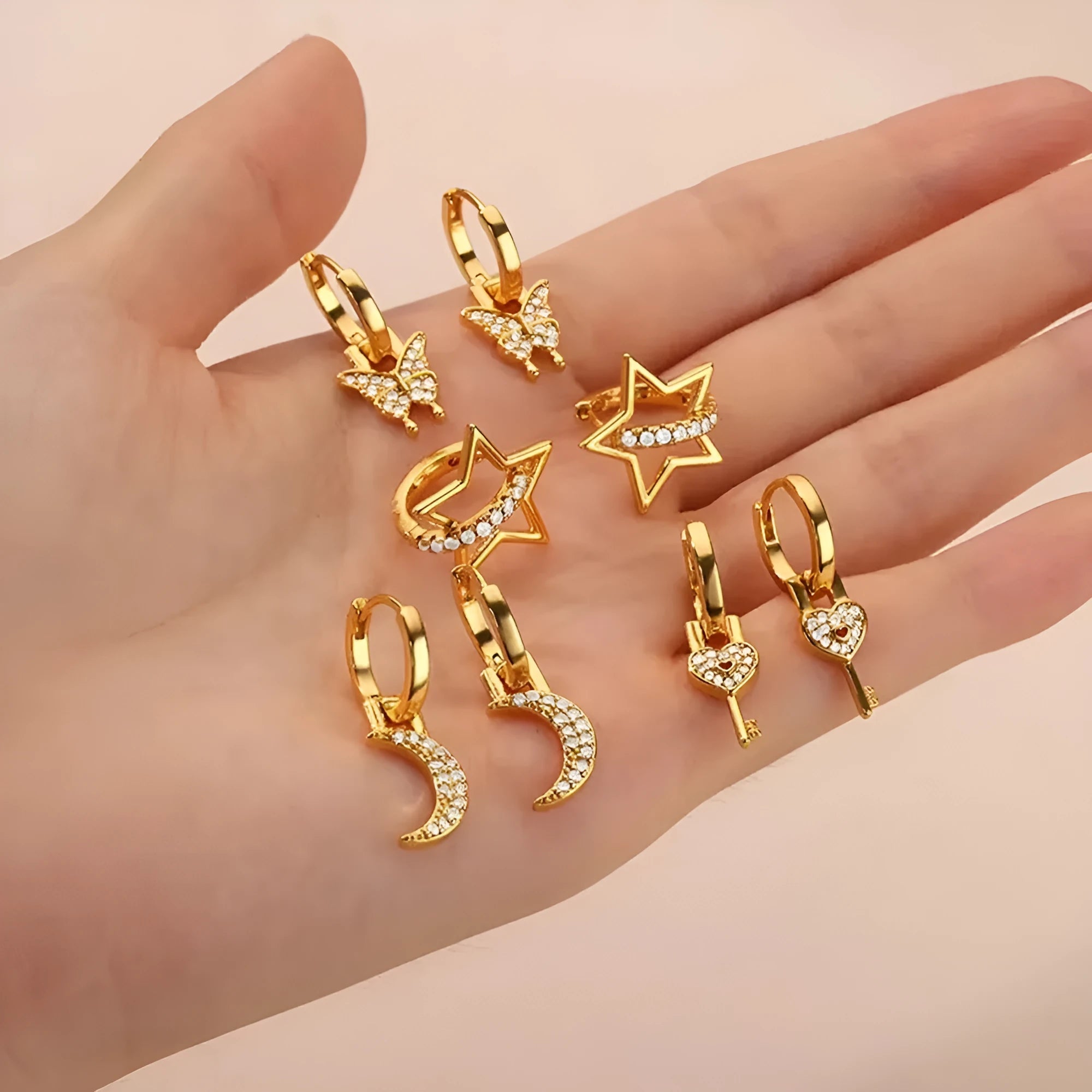 Copper butterfly earrings with irregular geometric design combining heart, bow and star shapes in diamond colour treatment