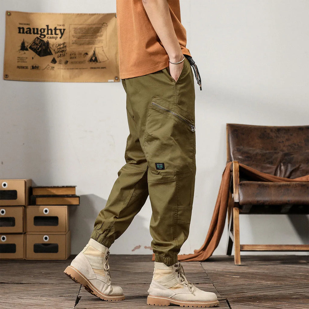 Men's tapered harem trousers in cotton fabric with elastic waist and ankle banding detail