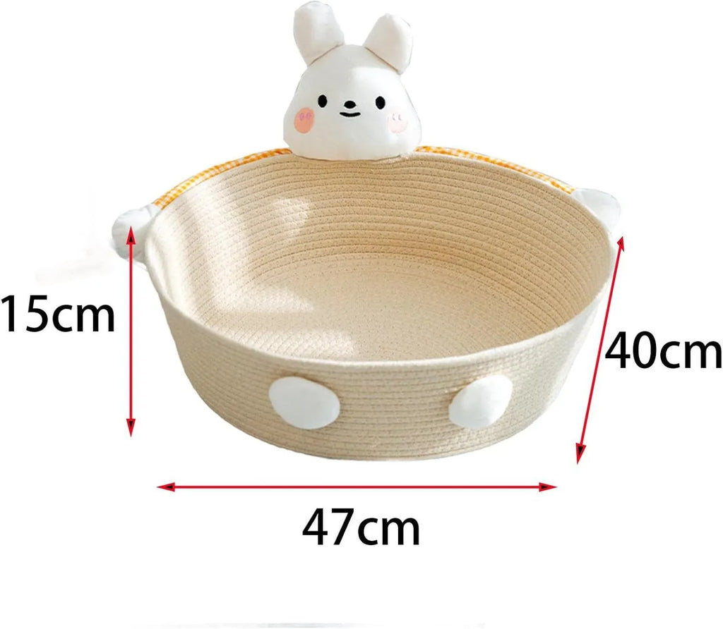 Woven cotton rope cat bed and scratching board basket shown in a home setting.