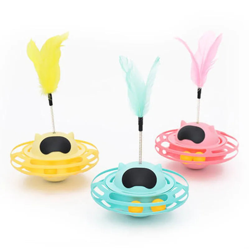 Pink cat tumbler turntable toy with rotating base and attached stick on white background
