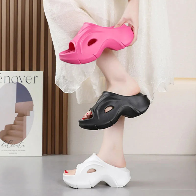Women's white EVA beach slippers with a thick sole and round toe.