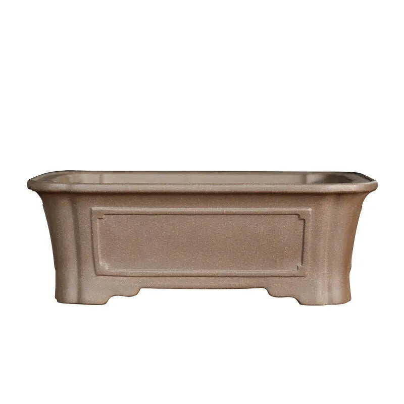 Rectangular antique purple sand bonsai pot on floor, showing Old Segment Mud textured finish.