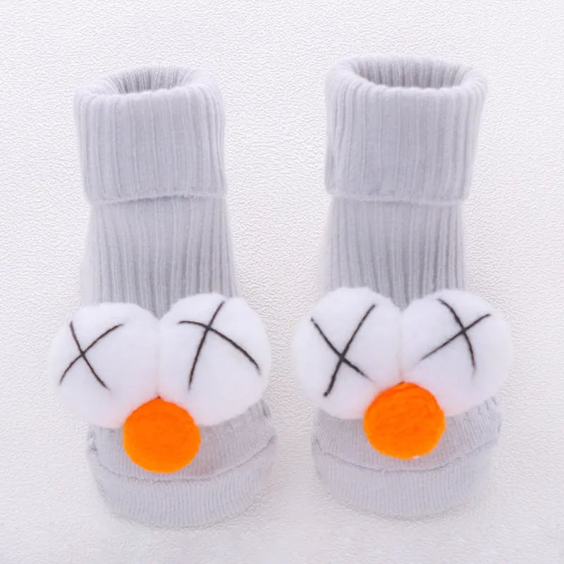 Cotton baby floor socks in multiple patterns including blue bow and lion designs