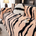 Zebra pattern flannel sofa cover in light luxury style draped over a sofa