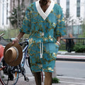 Men's peacock blue 3D printed knitted shorts suit with matching t-shirt, laid flat.