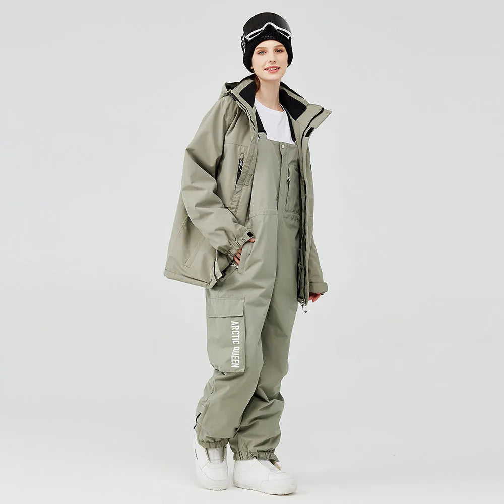 Unisex waterproof ski suit in blue top with black pants for winter snow sports