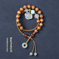 Women's ebony hand-woven double ring bracelet with Ruyi motif, available in Xiuyan jade colour