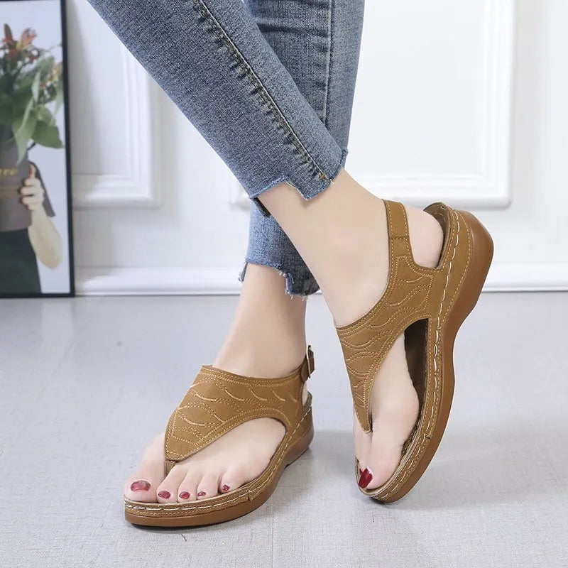 Women's casual wedge heel sandals in black with an adjustable back strap buckle.