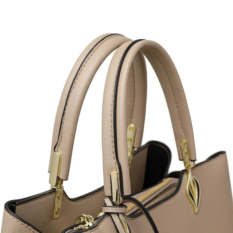 Women's black PU messenger bag with cross-body strap and multi-layer interior compartments.