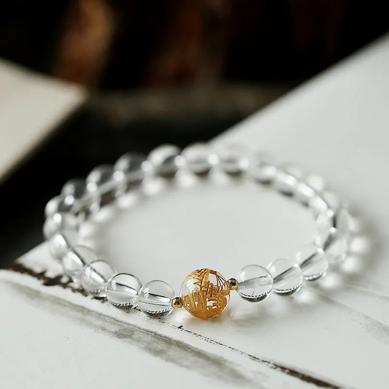 Unisex obsidian black agate white crystal bracelet with 10mm and 8mm beads on neutral background