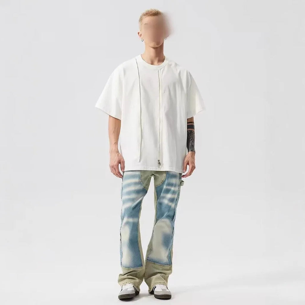 Retro dual-colour yellow and blue patchwork jeans with splash-ink damaged design, mid-waist cut
