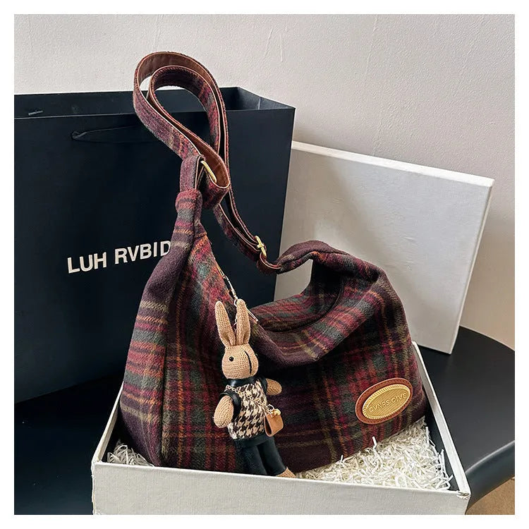 Large capacity soft woolen shoulder bag for women in khaki with pendant, horizontal square shape with sewing line detail.