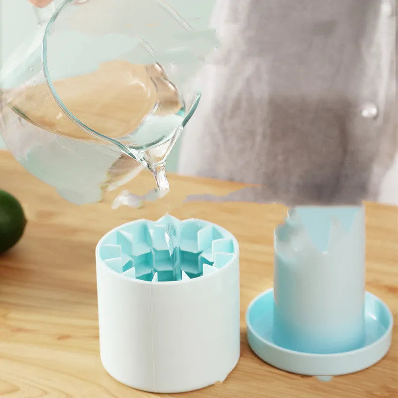 Portable 2-in-1 silicone ice bucket mold with lid in blue-green on a white background