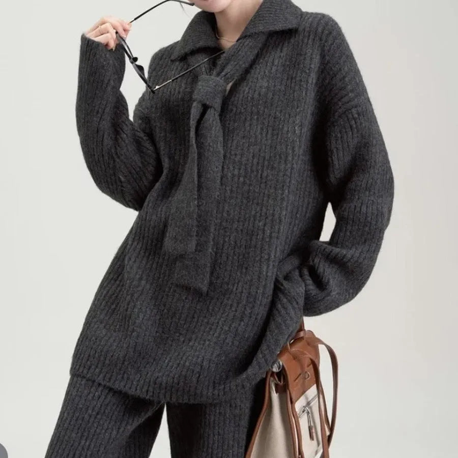 Women's beige imitation cashmere knitted sweater top and matching trousers two-piece set.