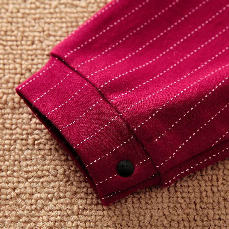 Wine red cotton baby boy romper with long sleeves and single-breasted front.