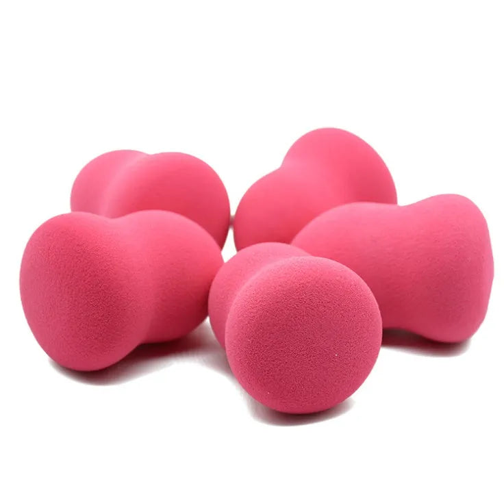 Pink hydrophilic non-latex makeup foundation sponge puff on a white background