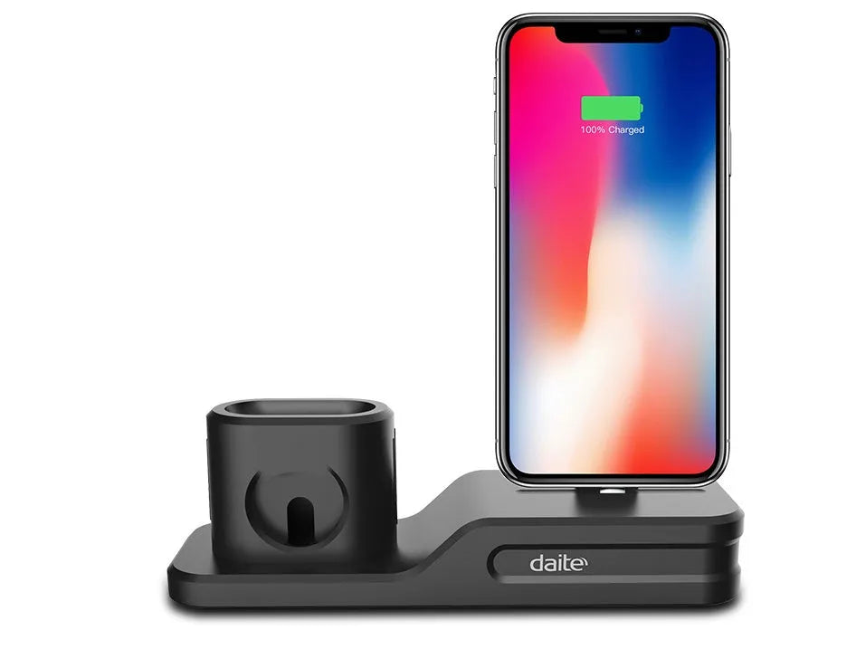 Black 3-in-1 silicone charging base for iPhone, iWatch, and AirPods on a desk