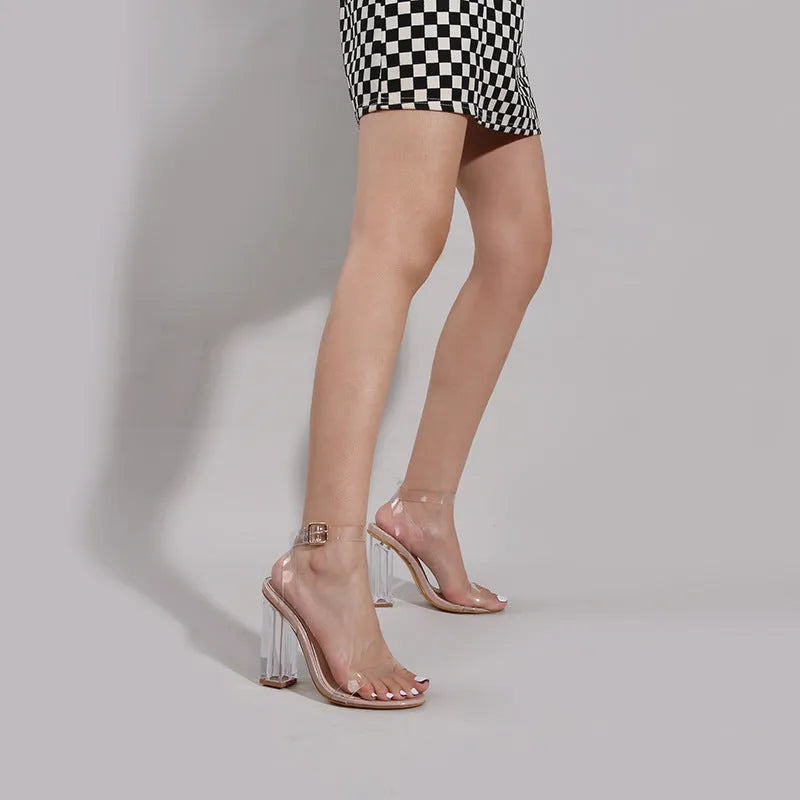 Apricot coloured women's high heel sandals with a glass heel, round toe, and buckle fastening.