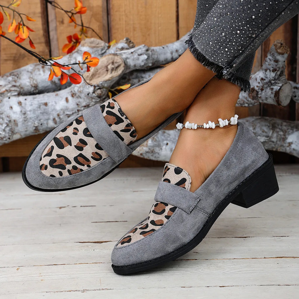 Women's brown leopard print suede slip-on shoes with chunky mid-heel and pointed toe on a white background.