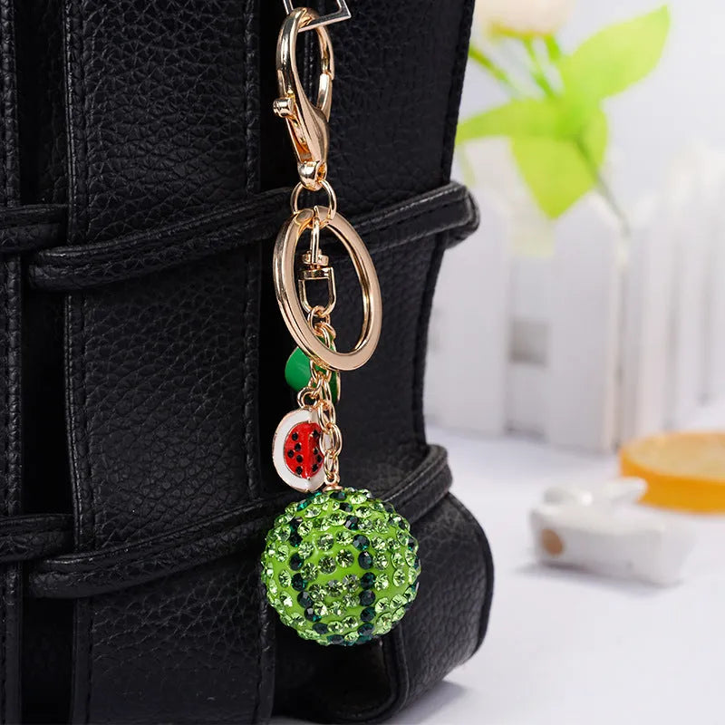 Green watermelon-shaped zinc alloy keychain measuring 12cm with metal chain attachment