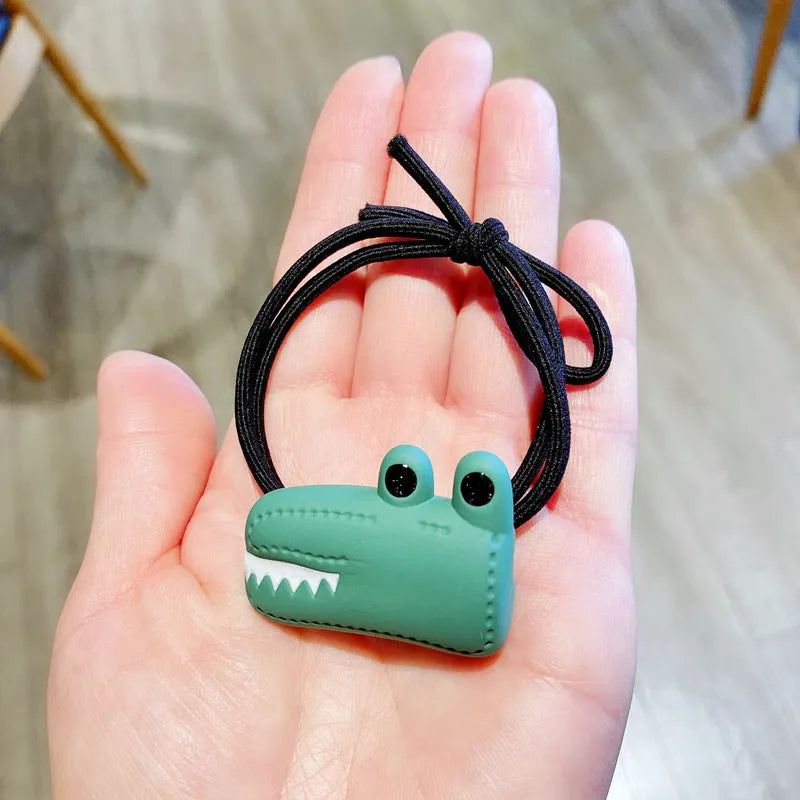 Animal cartoon hair accessories with crocodile dinosaur and frog designs in plastic resin material for women